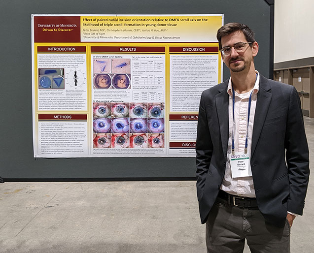 Peter poses with his poster at ARVO 2023